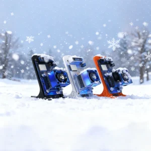 Three colorful 3D printer hotends (blue, white, orange) stand in the snow, dusted with snowflakes. The background shows a snowy, winter scene. A festive, tech-themed image.
